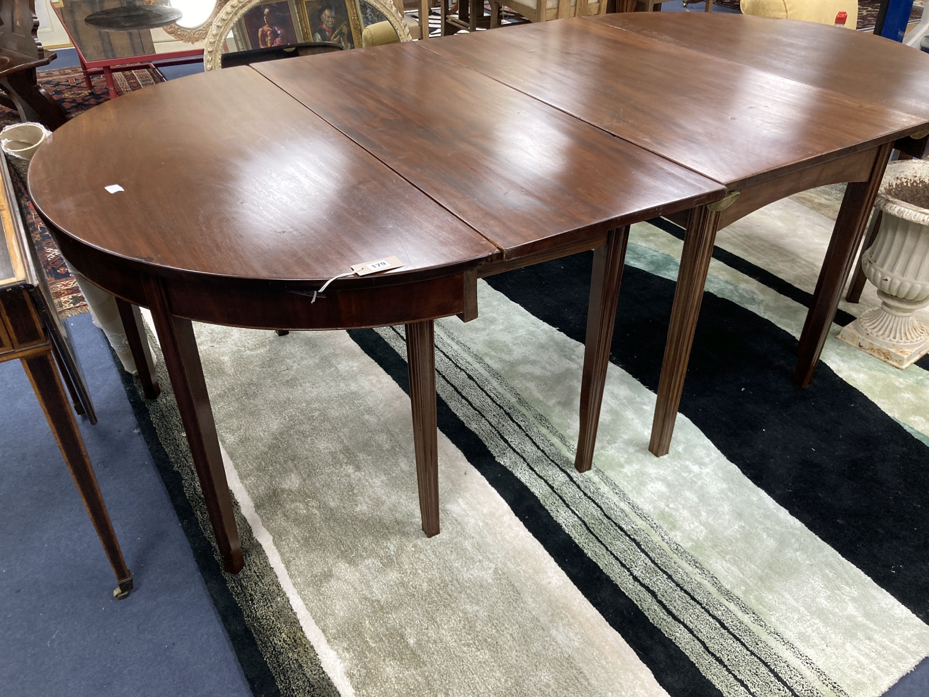 A George III mahogany D end extending dining table. 220cm extended. W-118, H-71cm.